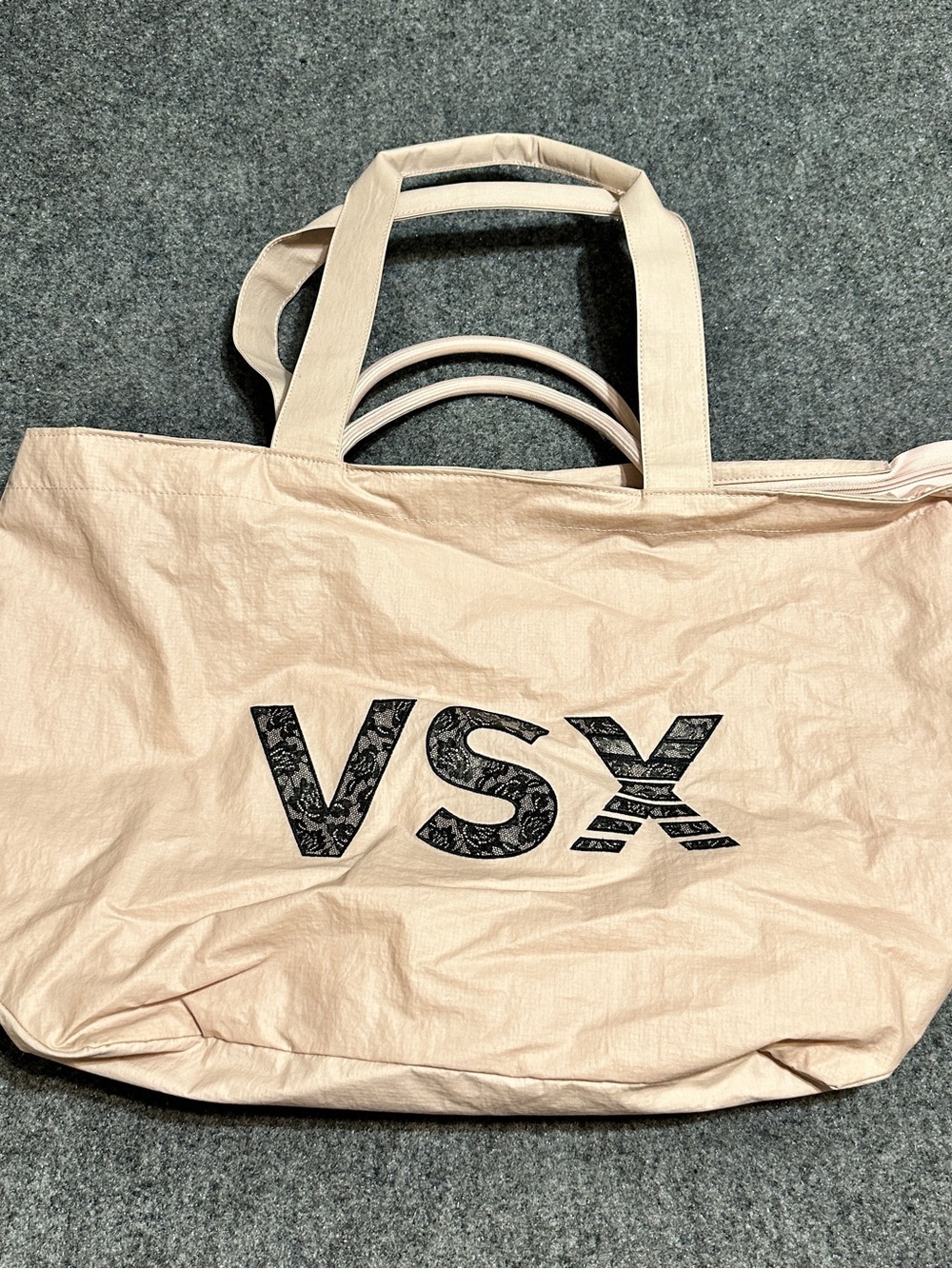 This is a light pink Victoria's Secret VSX Tote Bag